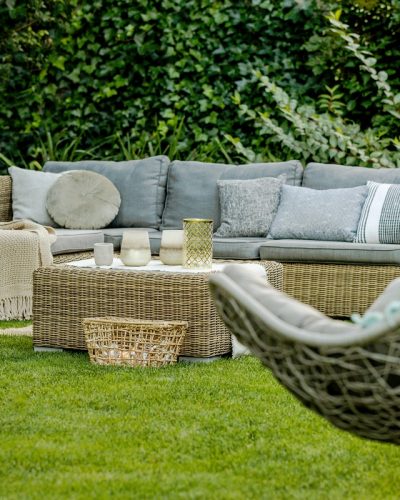 Modern designed green garden with rattan furniture